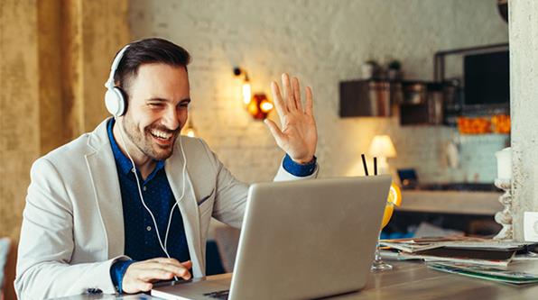 Man attending remote meeting on a laptop