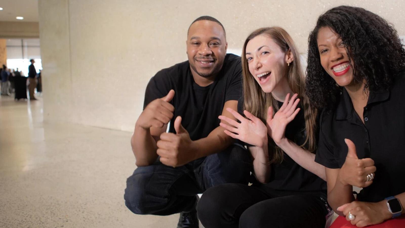 Group of Verizon employees smiling.