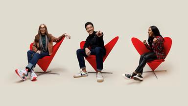 Verizon employees in red chair.