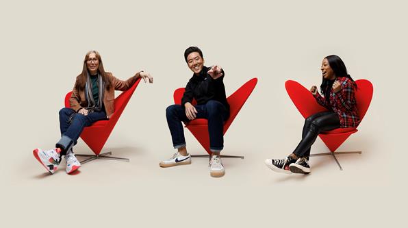 Verizon employees in red chair.