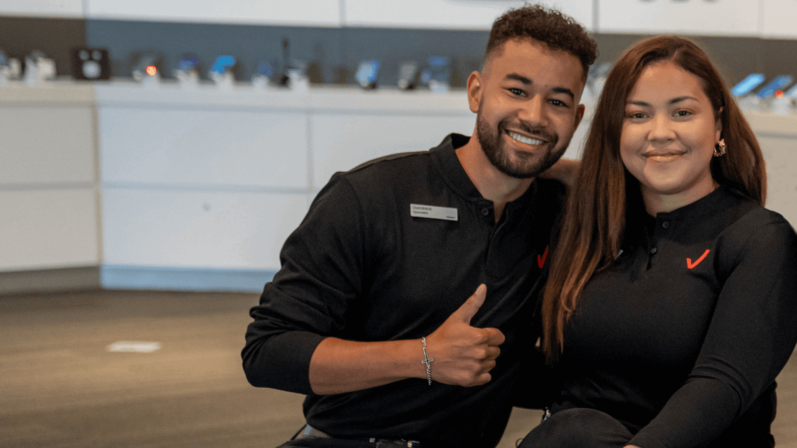 Two Verizon Retail Employees In The Store