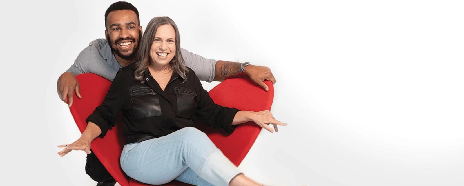 Man And Woman Red Chair Smiling