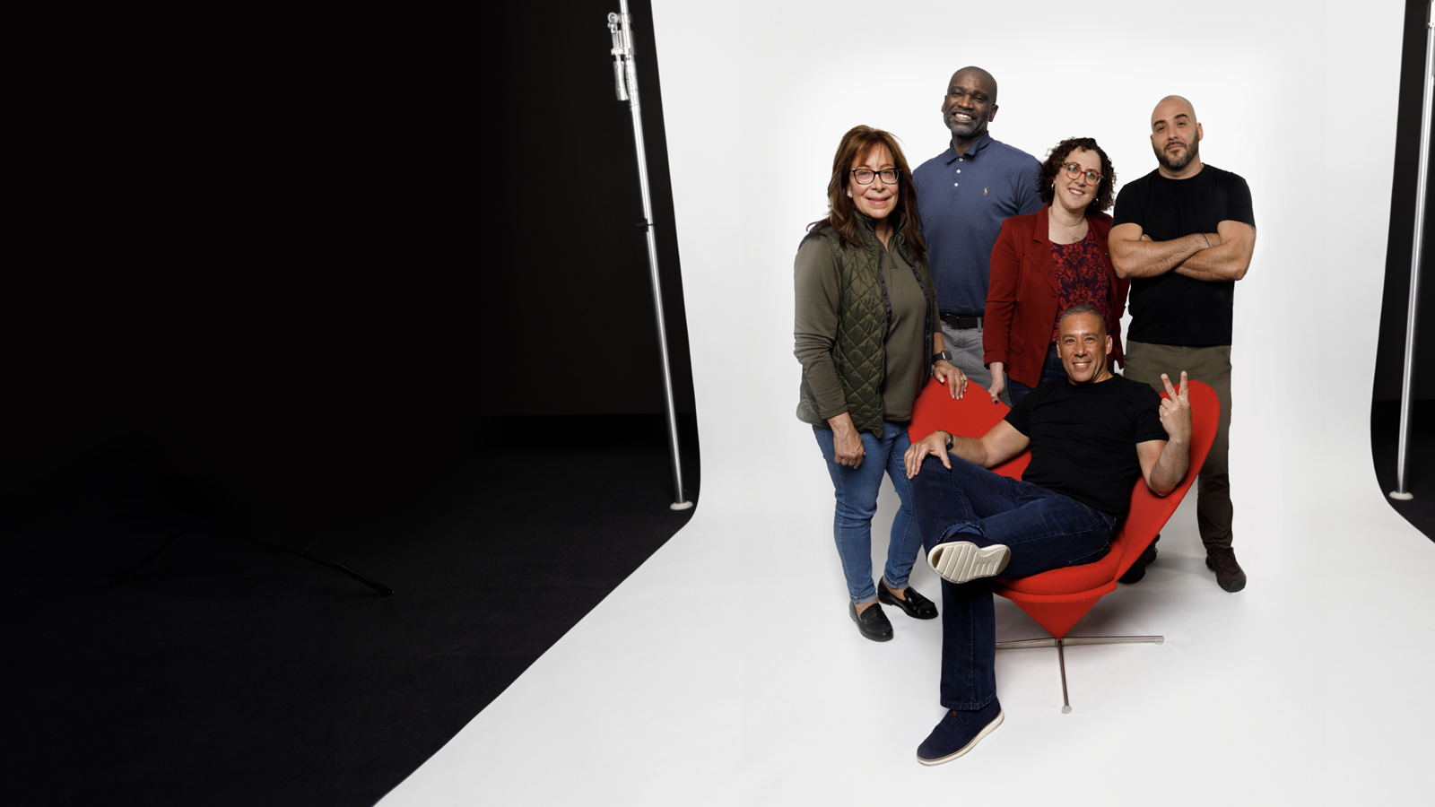 Group Of Military V Teamers Posing With The Red Chair