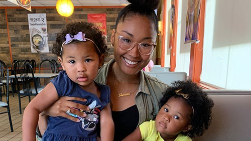 Tamika holding two children