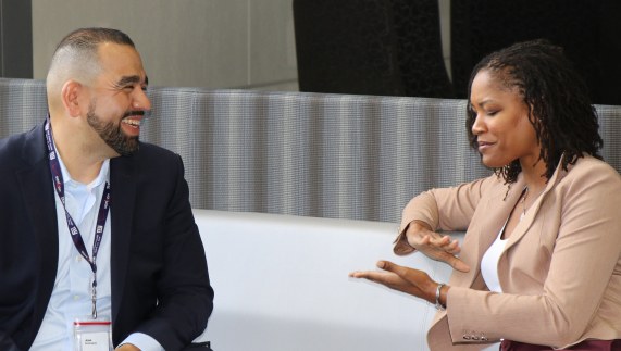 One Colleague Explaining Something To Another