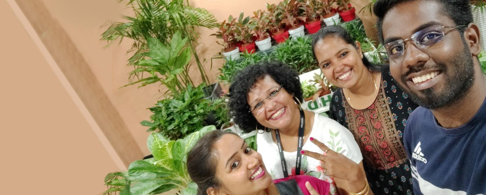 Group Of Colleagues With Plants